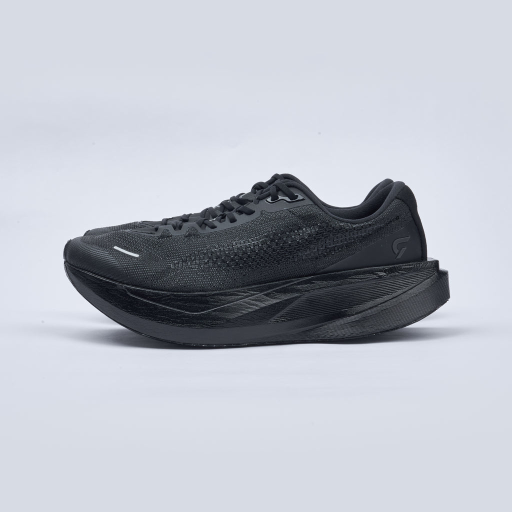 Black running shoe on a light gray background