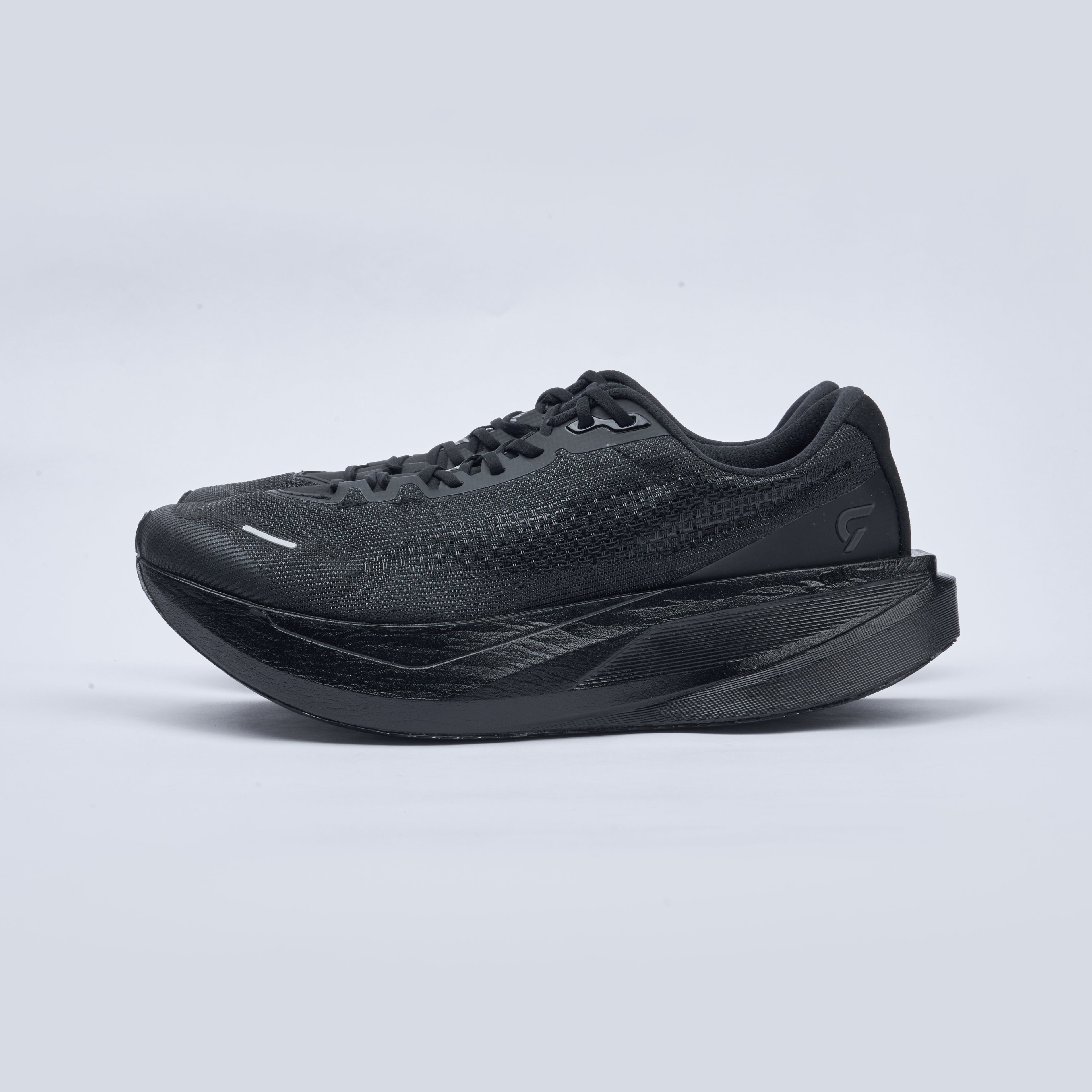 Black running shoe on a light gray background